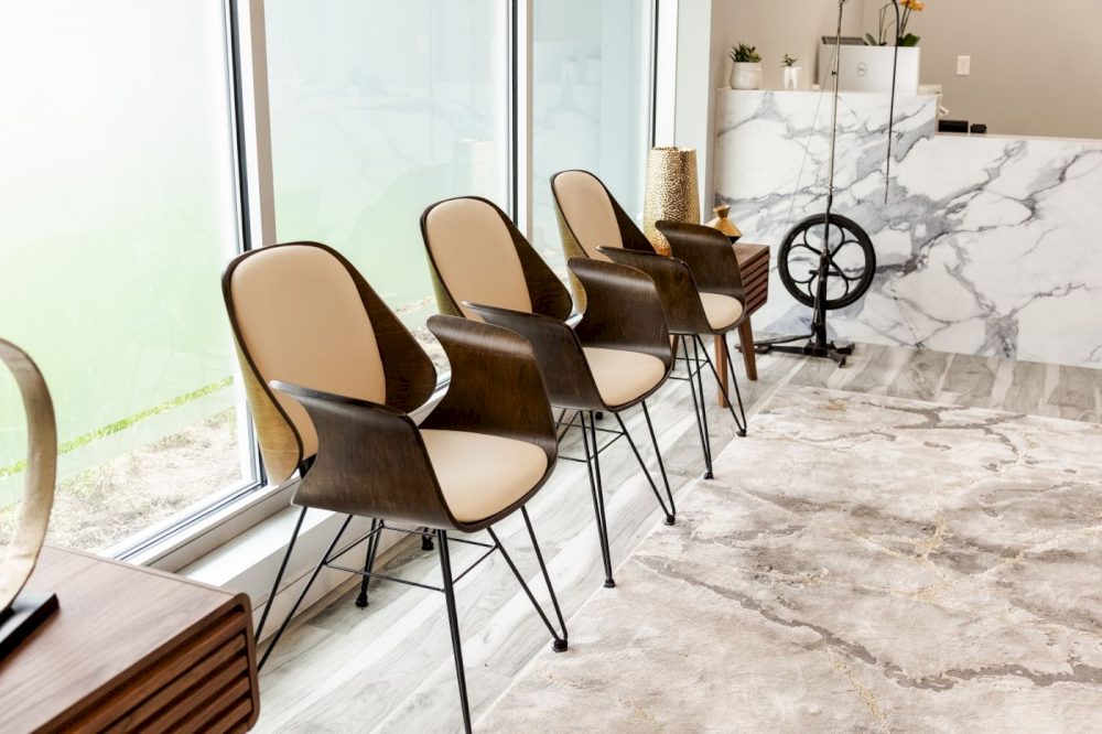 Waiting chairs along the window wall at Soothing Dental