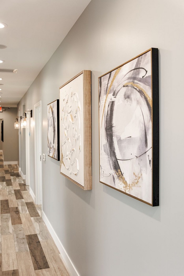Framed artwork along the treatment corridor at Soothing Dental