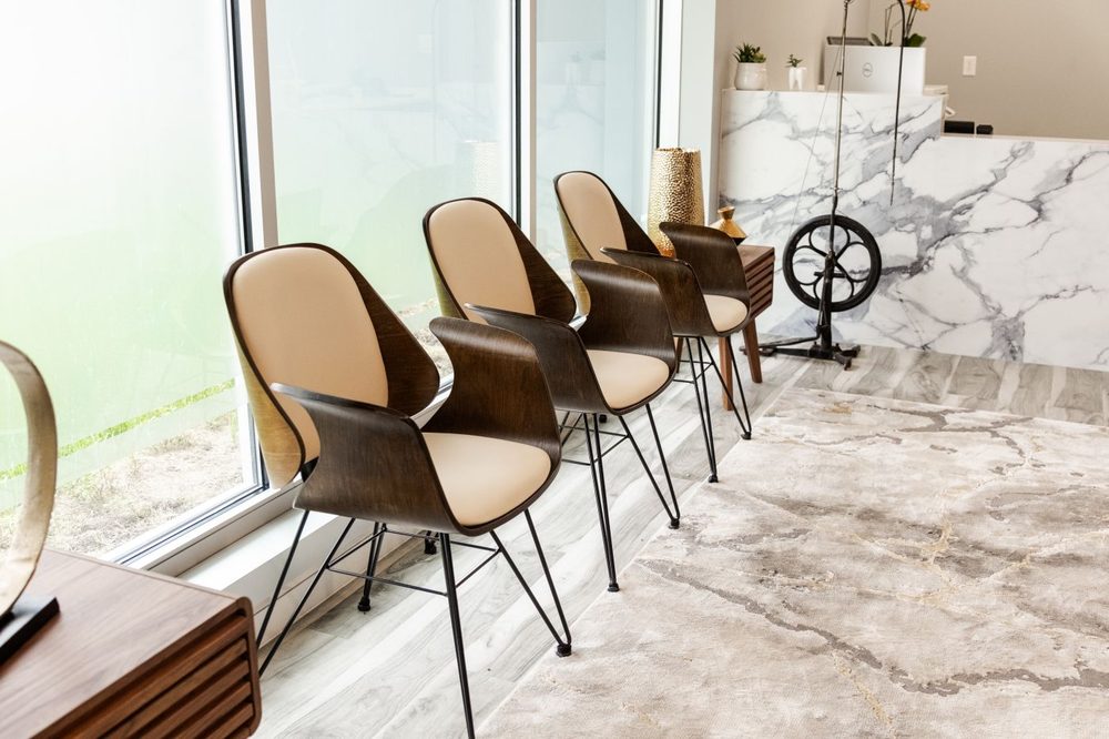 Waiting chairs along the window wall at Soothing Dental